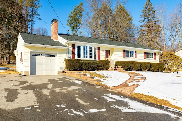 single story home with a garage