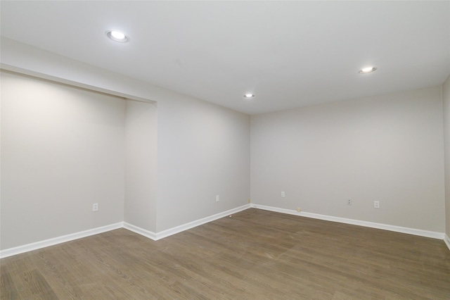 empty room with hardwood / wood-style floors