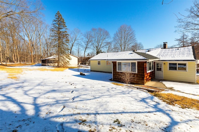 view of snow covered house