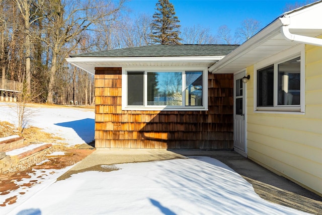 view of snow covered property entrance