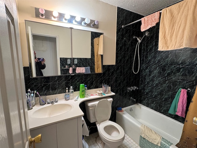 full bathroom with tub / shower combination, vanity, a textured ceiling, tile walls, and toilet