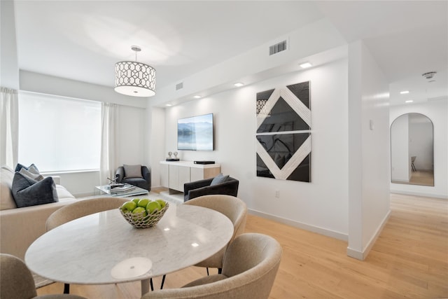 dining area with light hardwood / wood-style flooring