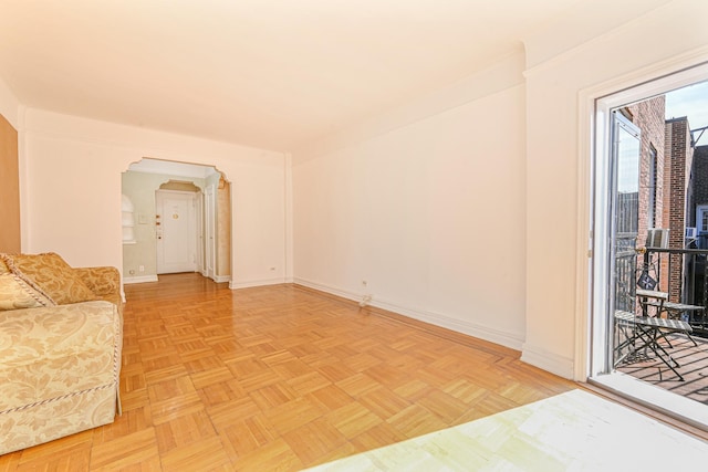 unfurnished living room featuring light parquet flooring