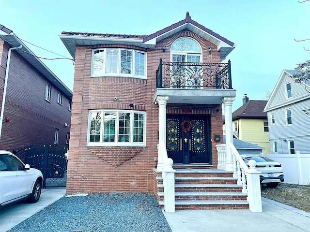 view of front of home with a balcony