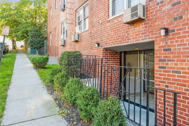 view of home's exterior featuring a wall mounted air conditioner