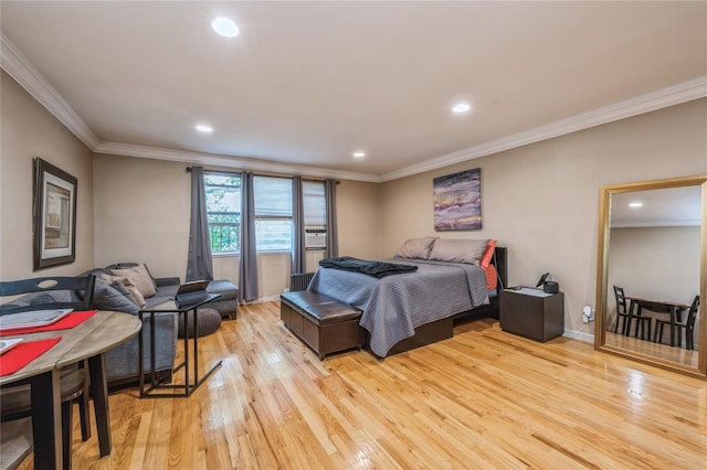 bedroom featuring light wood-type flooring and crown molding