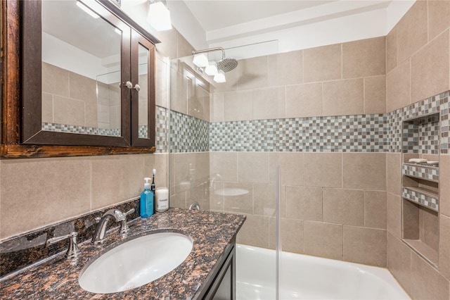 bathroom featuring vanity and bath / shower combo with glass door