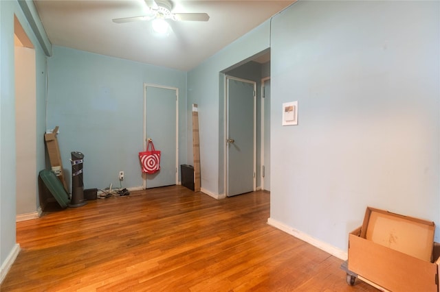 interior space with hardwood / wood-style flooring and ceiling fan