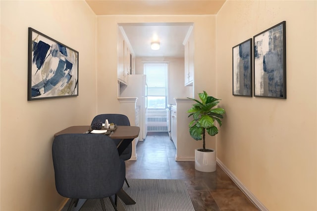 corridor featuring dark tile patterned flooring