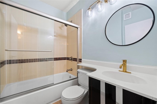 full bathroom featuring vanity, toilet, and bath / shower combo with glass door