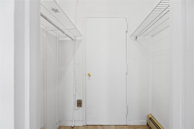 spacious closet with baseboard heating