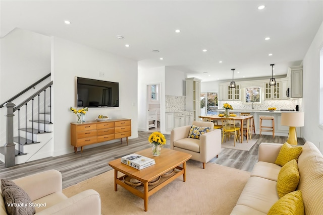 living room with light hardwood / wood-style flooring