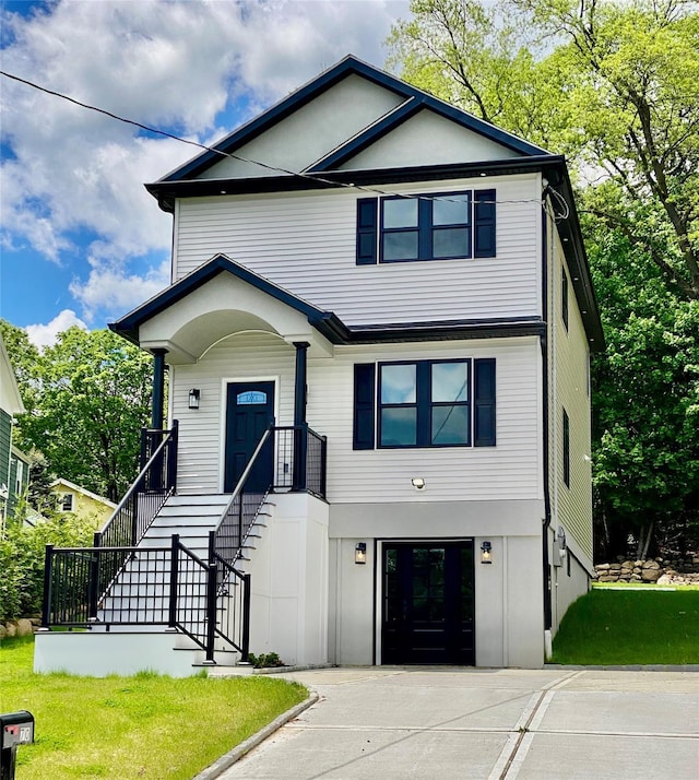 70 W Broadway, Nyack, NY 10960 - view of front of home with stairs, an attached garage, a front yard, driveway, and a porch