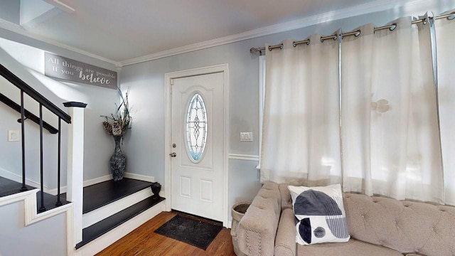 foyer with crown molding and hardwood / wood-style floors