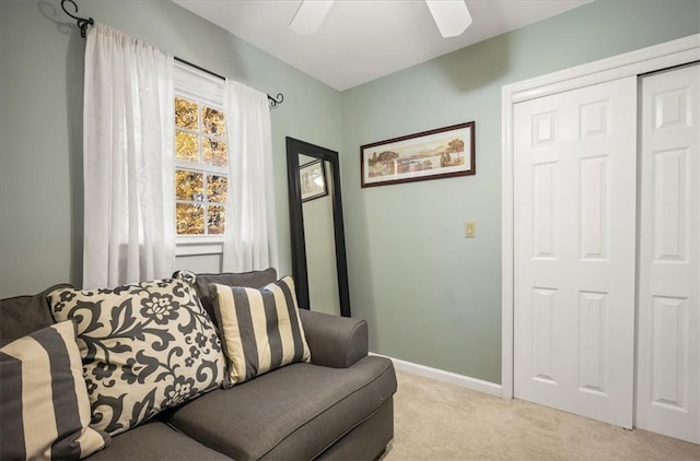 living room with ceiling fan and light colored carpet