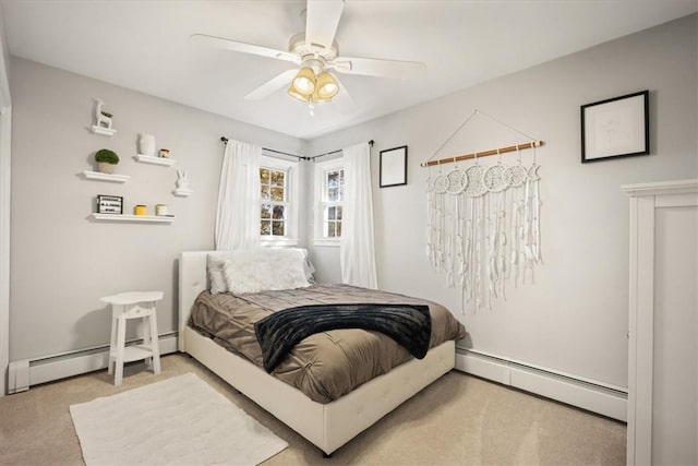 bedroom with ceiling fan, carpet floors, and baseboard heating