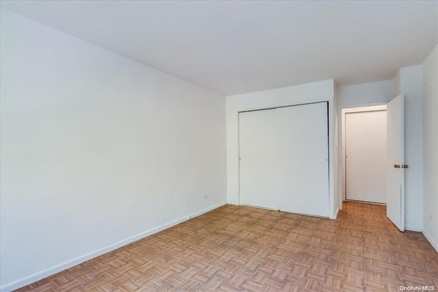 unfurnished bedroom with light parquet floors