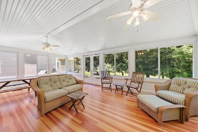 sunroom / solarium with ceiling fan, french doors, and vaulted ceiling