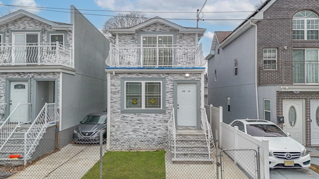 view of front of home with a balcony