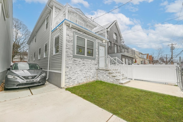 view of property exterior with a yard