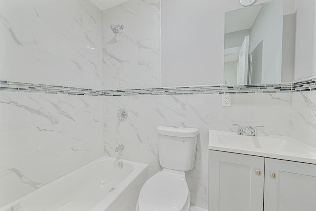 full bathroom with tiled shower / bath, vanity, toilet, and tile walls