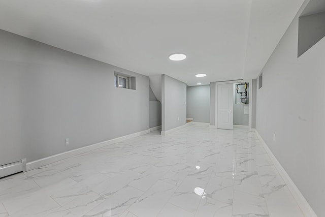 basement featuring a baseboard heating unit