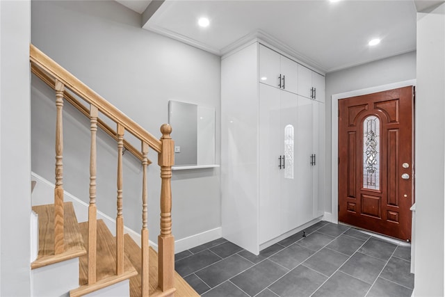 entryway featuring dark tile patterned floors