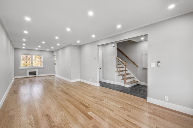 unfurnished living room with light hardwood / wood-style flooring