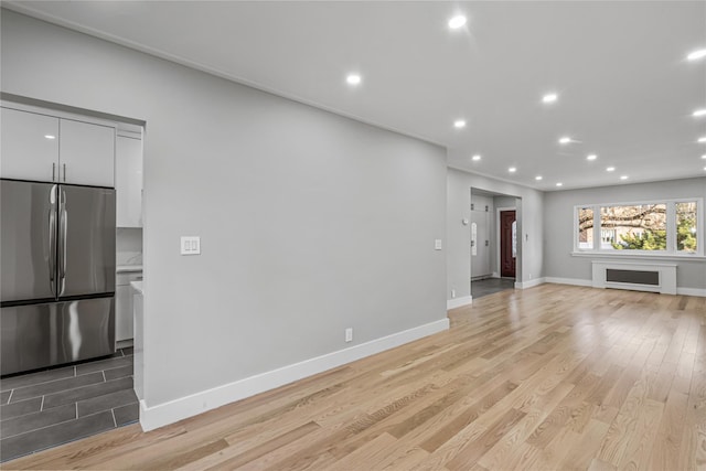 unfurnished living room with light wood-type flooring