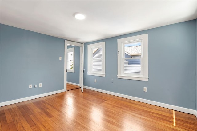 spare room featuring hardwood / wood-style flooring