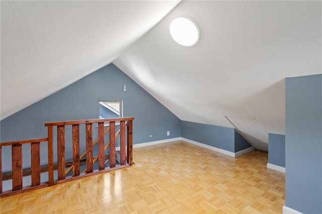 bonus room featuring light parquet flooring and lofted ceiling