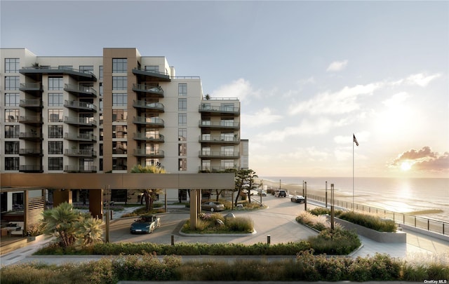 outdoor building at dusk featuring a water view