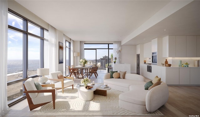 living room with sink, light hardwood / wood-style flooring, floor to ceiling windows, and a water view