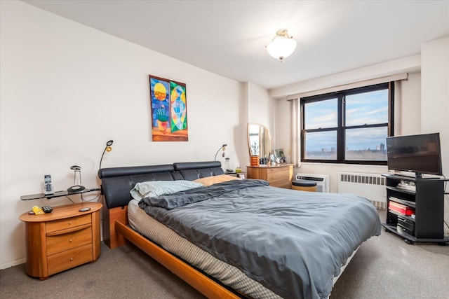 bedroom with carpet flooring and radiator