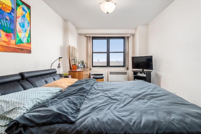 bedroom featuring radiator