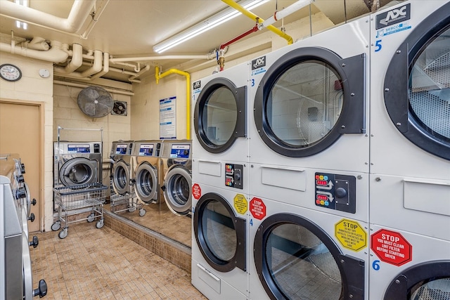 laundry area with washer and dryer and stacked washer and dryer