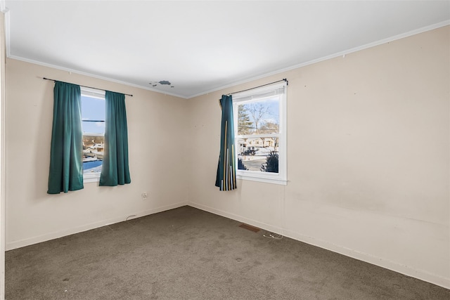 carpeted spare room with crown molding