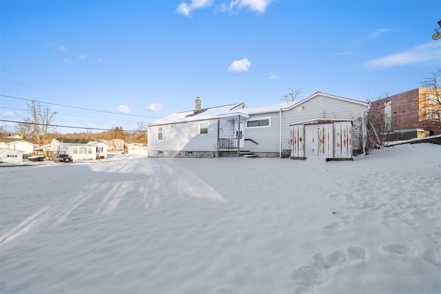 view of snow covered house