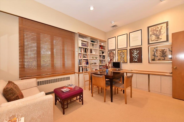 office featuring light colored carpet and radiator