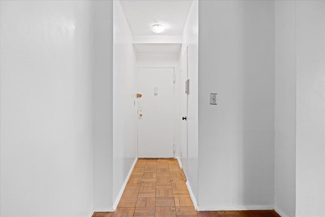 hall with light parquet floors