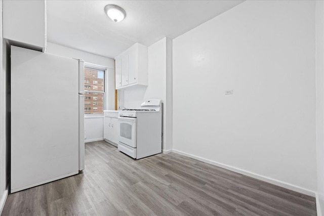 laundry room with light hardwood / wood-style flooring