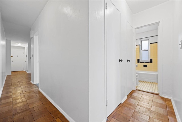 hallway with light parquet floors