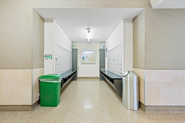 interior space featuring tile walls