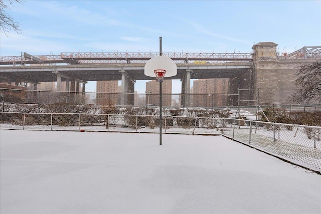 snow covered patio with basketball hoop