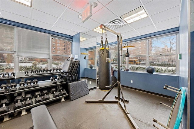 workout area featuring a drop ceiling