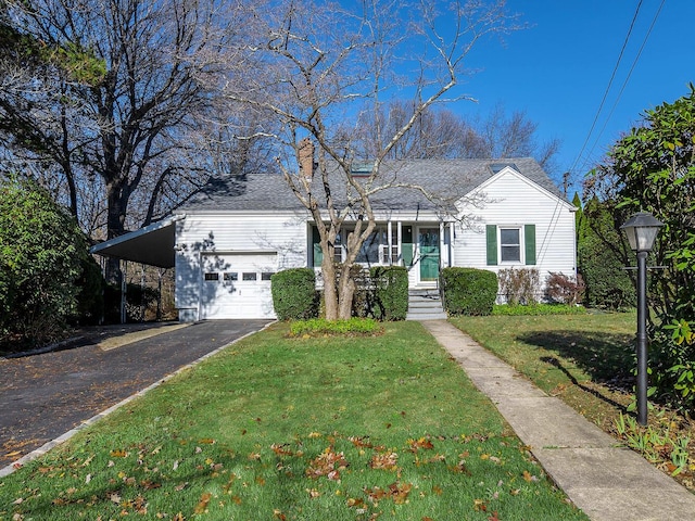 view of front of property with a front yard and a carport