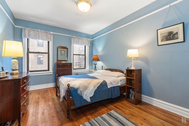 bedroom featuring dark wood-type flooring