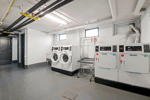 clothes washing area featuring washing machine and clothes dryer