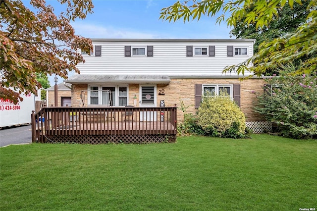 view of front property featuring a deck and a front lawn