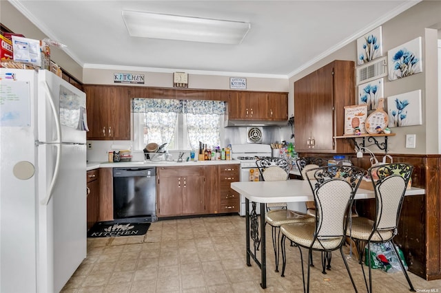 kitchen with sink, white appliances, and ornamental molding